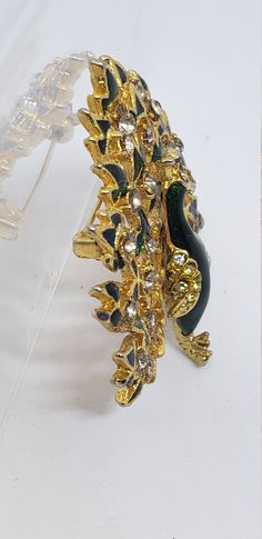 This awesome peacock is showing off his beauty on a grand scale. Green enamel and shiny golden tone is the showcase for the crystal stones. It is approx. 1 3/4 in. tall and 2 in. wide. It is in very good vintage condition. Enjoy!! The majority of the jewelry that I have was my grandmothers and she had a lot and loved wearing them all the time. Thank you so much for looking Please check out my other items at my store. I'm new to this selling on line, I'm not a computer wiz at all LOL, so it is a Peacock Brooch, Wedding Brooches, Wedding Brooch, Naples Fl, Crystal Stones, Green Enamel, The Wiz, Naples, Stones And Crystals