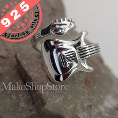 Guitar adjustable spoon ring unisex Material: Sterling Silver 925 Size Adjustable size 7.5 to 11 (shown preset at 9.5 on pictures) Stamped "925" High-polish made by hand stunning quality! Comes with jewelry box ready to ship Music-themed Silver Ring As A Gift, Silver Music-themed Rings For Gifts, Music-themed Silver Rings For Gifts, Music-themed Silver Rings As Gifts, Music-themed Silver Rings For Gift, Guitar Ring, Musician Gifts, Spoon Ring, Spoon Rings