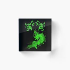 a green and black animal with horns on it's head acrylic glass block