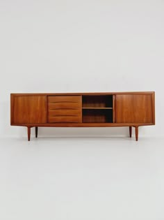 the sideboard is made out of wood and has drawers