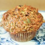 a muffin sitting on top of a blue and white plate