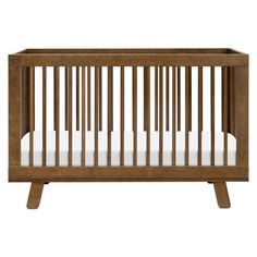 a wooden crib with white sheets on the bottom and side rails, against a white background