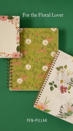 three notebooks with flowers on them and the words pen - pillar for the floral lover