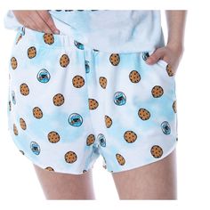 a person wearing pajamas with cookies on them and holding their hands in his pockets,