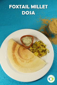 a white plate topped with food on top of a blue table