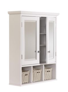 a white cabinet with two doors and three baskets on the bottom shelf next to it