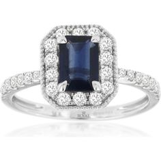 Uncover the union of unmatched elegance with this breathtaking sapphire and diamond ring, a masterpiece designed to captivate hearts and turn heads. The center stage is graced by a mesmerizing 1.09-carat emerald-cut sapphire, exuding a rich, deep blue hue that speaks of timeless luxury and sophistication. This stunning gem is embraced by a halo of sparkling diamonds, meticulously set to enhance the sapphire's regal beauty and amplify its brilliance.Crafted in lustrous 14K white gold, the ring's band is adorned with additional diamonds, seamlessly flowing into the halo for a continuous display of sparkle. The diamonds, totaling 0.50 carats, create a dazzling contrast against the vivid sapphire, making this ring an embodiment of elegance and charm. The meticulous attention to detail is evide White Gold Sapphire, Sapphire And Diamond Ring, Timeless Luxury, Sapphire Color, Luxury Rings, Sapphire Diamond Ring, Royal Jewelry, Halo Diamond Ring, The Union