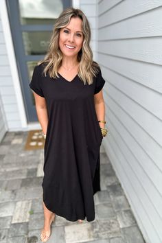 Wait until you feel how buttery soft this maxi dress is. Features a v-neckline, side slits and pockets. Model is 5'3" wearing a small 94% poly 6% Spandex hand wash or dry clean made in the USA! Black V-neck Maxi Dress With Side Slits, Black Short Sleeve Maxi Dress For Loungewear, V-neck Relaxed Fit Maxi Dress For Loungewear, Relaxed Fit V-neck Maxi Dress For Loungewear, Black V-neck Midi Dress With Side Slits, Black Relaxed Fit Maxi Dress For Loungewear, Relaxed Fit V-neck Maxi Dress, Relaxed Fit Solid Color V-neck Maxi Dress, V-neck Loungewear Dress With Side Slits