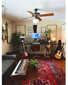 a living room filled with lots of furniture and musical instruments on top of a rug