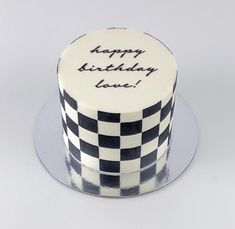 a black and white birthday cake with the words happy birthday love written on it