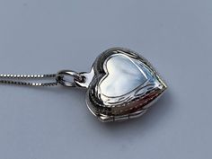 "Solid Sterling Silver Heart Locket -925 Sterling Silver -Heart Shaped Locket -Holds 2 Pictures -Stamped 925 -Hand carved and crafted -Box Chain Necklace in 14\", 16\", 18\" or 20\" 🎁Packaging: This item comes gently packaged in a fabric pouch housed inside of a silver foil linen box with a silver bow. It is ready to present as a gift to someone special or to keep as a gift to yourself! 🚛 Shipping: Shipped from USA. Shipping is free within USA with tracking on all order $35 or more. Express de Silver Heart Bracelet For Anniversary, Silver Adjustable Heart Necklace For Wedding, Adjustable Silver Heart Necklace For Wedding, Silver Double Heart Jewelry For Wedding Gift, Unique Locket, Polish Clothing, Silver Heart Locket, Heart Shaped Locket, Victorian Locket