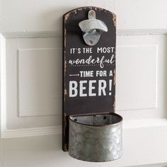 a sign that says it's the most wonderful time for a beer hanging on a door