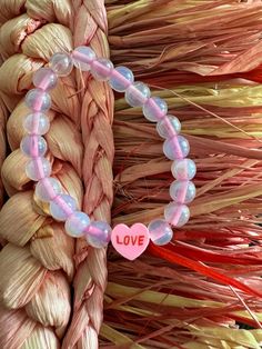 Adorable love bracelet with pink heart center bead and clear/pink accent beads. Super cute to add to a Valentine's Day outfit! Valentines Day Bracelet, Love Valentines Day, Heart Center, Manchester Nh, Love Bracelet, Valentine's Day Outfit, Star Bracelet, Pink Accents, Day Outfit