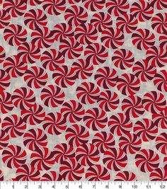 a red and white fabric with circles on it