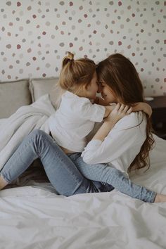 two women hugging each other on a bed with the caption, my friends it may never be happy but i can tell you