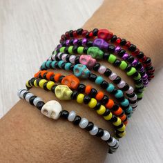 These colorful Halloween skull Stretch bracelets are handcrafted personally for me, Derlis. You can pick your size bracelet. Also, you can pick your favorite style, color combination, with or without skull, and make your own stack. A wonderful gift to your friends, family to wear this Mardi Gras, Halloween season/parties/parades and/or as part of your costume, to go trick or treating, or all year round.  Do not forget to get the matching earrings: https://www.etsy.com/listing/1544063575/hallowee Casual Adjustable Skull Beaded Bracelets, Halloween Skull Print Bracelet Gift, Handmade Casual Skull Bracelets, Handmade Casual Skull Bracelet, Casual Handmade Skull Bracelets, Adjustable Skull Print Bracelet As Gift, Handmade Stretch Bracelet For Halloween, Handmade Skull Bracelet As A Gift, Novelty Multicolor Beaded Bracelets For Halloween