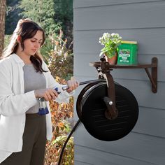 The Navigator rotating hose reel is the first wall mounted hose reel to rotate 360 degrees. Features eight locking positions to help wind and direct the hose to your desired location. This decorative, all steel hose reel can hold up to 125‘ of 5/8" water hose. Liberty Garden Elite Steel 125-ft Wall-mount Hose Reel Rubber in Black | 715 Garden Hose Reels, Liberty Garden, Garden Hose Reel, Hose Reels, Hose Reel, Water Hose, Garden Hose, Wall Mount, Water