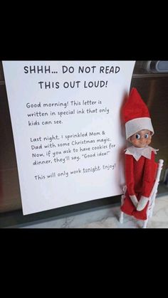 an elf with a sign in front of him that says shh do not read this out loud