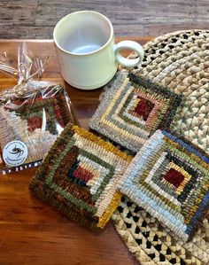 two coasters and a mug on a table