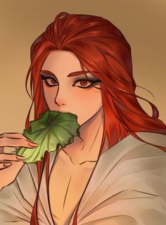 a woman with red hair is holding a leaf