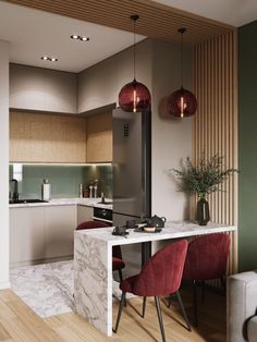 a kitchen and living room with wood flooring, green walls and white marble countertops