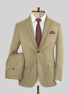 When it comes to high-quality clothes and luxury craftsmanship, Napolean is hard to beat. Our Napolean Sahara Khaki Wool Suit is crafted from wool blend with the natural elegance of wool with durability, versatility and stress-free comfort. Cut to a tailored fit in a fabric that's almost plain until you get up close – a fine structure gives it plenty of texture and couldn't be easier to style.  Look Includes   Napolean Sahara Khaki Wool Fabric  Two Button Jacket Style  Notch Lapel  Horn Brown Buttons  Single Vent  Three Cuff Buttons  Two Welted Back Pockets on Trousers    Click 'Customize Now' to modify the look if needed.   Lining: Viscose, Dry Clean, Pants can be lightly washed. Beige Wool Suits For Business Casual, Beige Wool Suits For Professional Tailoring, Beige Wool Suits For Tailoring, Tailored Beige Wool Suit, Beige Wool Suit For Semi-formal Occasions, Fitted Beige Suit With Concealed Placket, Beige Wool Suits For Semi-formal Occasions, Semi-formal Beige Wool Suit, Fitted Brown Suit With Concealed Placket