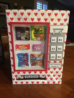 a valentine's day candy vending machine with hearts on the front and sides