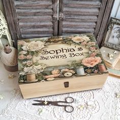 a sewing box with some scissors and thread