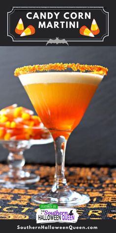 two martinis with orange garnish sit next to each other on a table