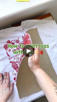 someone is cutting fabric with scissors on a piece of paper that says how to print trees with love