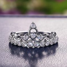 a tiara ring sitting on top of a table