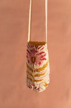 a small bag hanging from a string