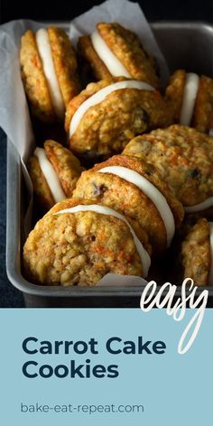 carrot cake cookies with white icing in a baking pan on a blue tablecloth