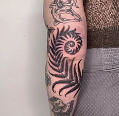 a person with a tattoo on their arm