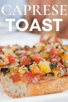 a close up of a piece of bread on a plate with text that reads caprese toast