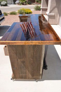 a wooden table with an american flag painted on it