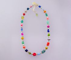 Brighten up your look with this colorful handmade necklace. It features a mix of vibrant Czech beads, natural gemstones, glass beads, and unique handpainted beads. Length: 16 inches with 2-inch adjustable chain. *Beads may vary slightly Beaded Flower Necklace, Colored Necklace, Friendship Necklace, Colorful Necklace, Necklace Colorful, Friendship Necklaces, Bright Colored, Necklace Beaded, Colourful Necklace