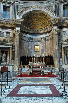 the interior of a church with marble floors and walls