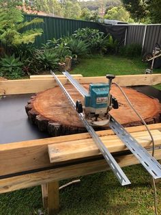 a circular saw sits on top of a piece of wood