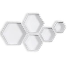 three white hexagonal trays sitting next to each other on a white surface