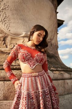 Carnelian Red Lehenga Set- Featuring meticulous hand embroidery and delicate pearl embellishments, the lehenga is crafted from opulent raw silk and velvet. The net full sleeve blouse and dupatta add a touch of sheer elegance.From Jigar Nikita’s 11:11 In Paris collection DELIVERY TIMEPlease allow 8-12 weeks for your outfit to arrive. FABRIC DETAILSLehenga - Raw Silk & Velvet Blouse - Net and Raw Silk, Dupatta - Net Professional cleaning only. Full Sleeve Blouse, Velvet Blouse, Red Lehenga, Velvet Blouses, Silk Dupatta, 12 Weeks, Professional Cleaning, Silk Velvet, The Net