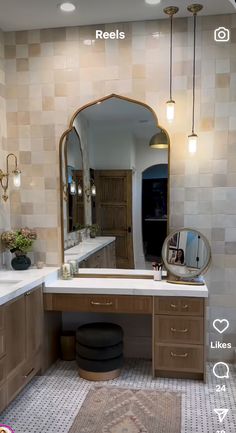 a bathroom with a sink, mirror and stool