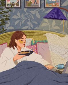 a woman laying in bed with a plate of food on her lap while using a laptop