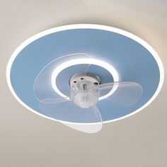 a ceiling fan with a light on it in the middle of a white and blue room