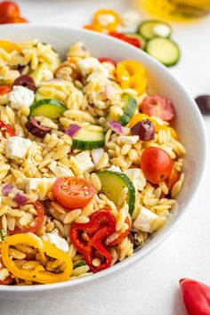 This Greek orzo salad is made with cucumbers, tomatoes & feta cheese, all tossed in a homemade vinaigrette dressing. It's packed with flavor! Mediterranean Orzo Pasta, Homemade Vinaigrette Dressing, Mediterranean Orzo Pasta Salad, Mediterranean Orzo, The Novice Chef, Greek Orzo, Salad Appetizer Cups, Greek Orzo Salad, Sweet Custard