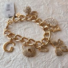 Guess Remarkable Rhinestone Bracelet-Guess Jewelry Dimension: 7.5 In Long Charm Bracelet, Chunky Bracelet New Chunky Charm Bracelet, Shiny Bracelets, Guess Jewelry, Accessory Inspo, Womens Bangles, Hook Bracelet, Chunky Bracelet, Cable Bracelets, Gold Charm Bracelet