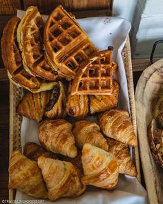 some croissants and other pastries in a basket