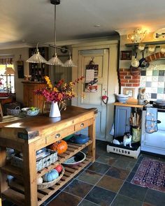 a kitchen filled with lots of counter top space and decor on the wall above it