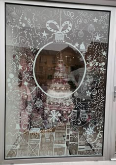 a decorated window with a cake in the middle