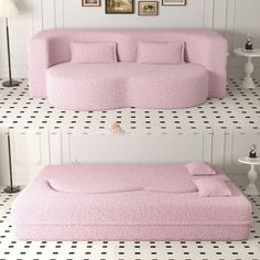 a pink couch sitting on top of a white floor next to a table and lamp